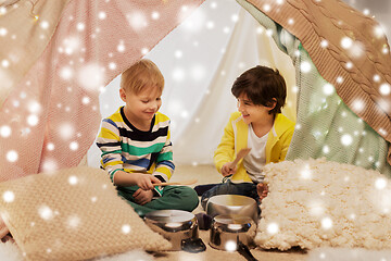 Image showing boys with pots playing music in kids tent at home