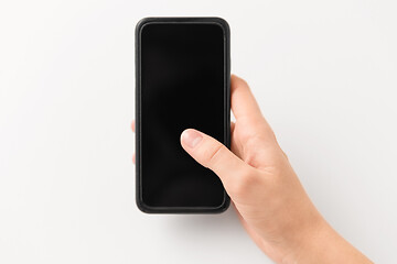 Image showing close up of hand with black smartphone