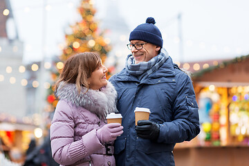 Image showing senior couple with coffee at christmas market