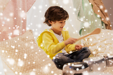 Image showing boy with pots playing music in kids tent at home