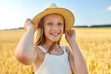 Image showing portrait of girl in straw hat on field in summer