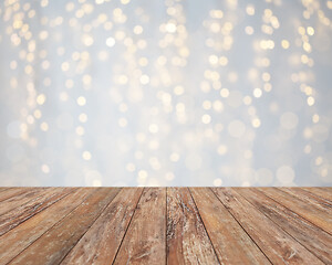 Image showing empty wooden table with christmas golden lights