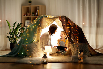 Image showing family with tablet pc in kids tent at home