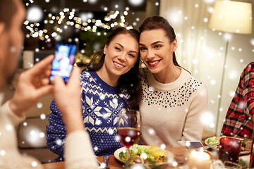 Image showing friends having christmas dinner and taking picture