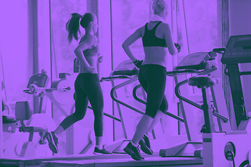 Image showing woman exercising on treadmill in gym