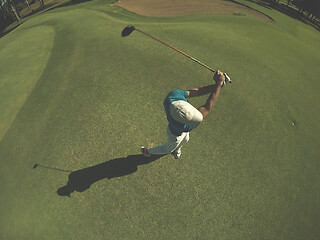 Image showing top view of golf player hitting shot