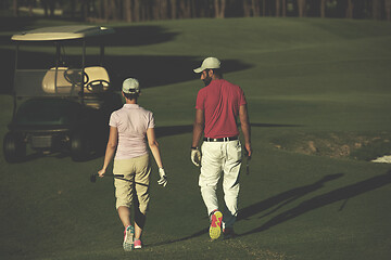 Image showing couple walking on golf course