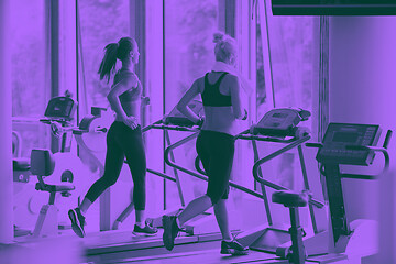 Image showing woman exercising on treadmill in gym