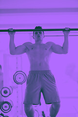 Image showing handsome young mand working out in gym