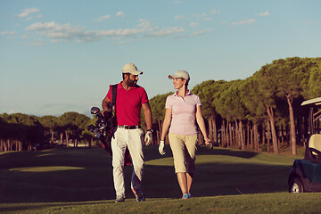 Image showing couple walking on golf course