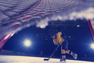 Image showing teen ice hockey player in action