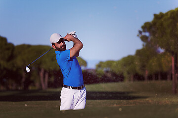 Image showing pro golfer hitting a sand bunker shot