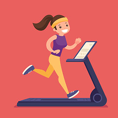 Image showing Young caucasian white woman running on treadmill.