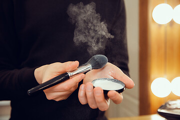 Image showing Professional makeup artist working at salon