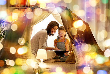 Image showing family with tablet pc in kids tent at home