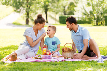 Image showing happy family having picnic at summer park