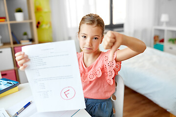 Image showing sad student girl with failed school test at home