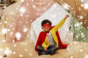 Image showing happy boy in super hero stuff in kids tent at home