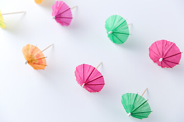 Image showing cocktail umbrellas on white background