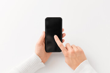 Image showing close up of hands with black smartphone