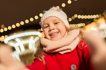 Image showing little girl taking selfie at christmas market