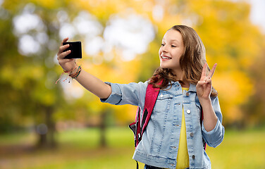 Image showing teenage student girl taking selfie by smartphone