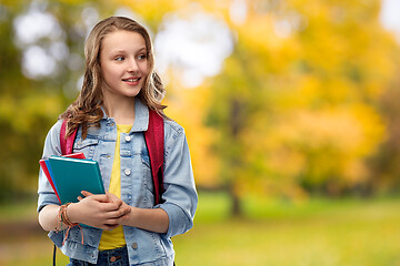 Image showing happy smiling teenage student girl with school bag