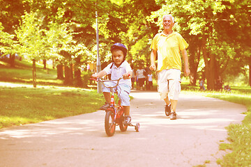 Image showing happy grandfather and child in park