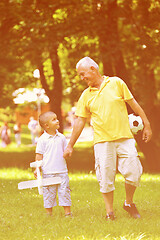 Image showing happy grandfather and child in park