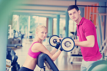 Image showing young sporty woman with trainer exercise weights lifting