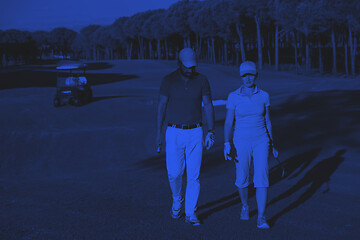 Image showing couple walking on golf course