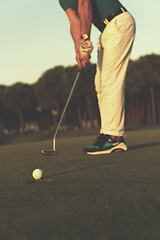 Image showing golfer  hitting shot at golf course