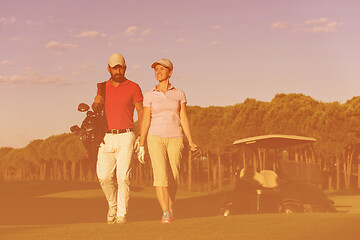 Image showing couple walking on golf course