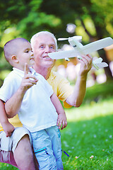 Image showing happy grandfather and child in park