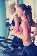 Image showing woman exercising on treadmill in gym