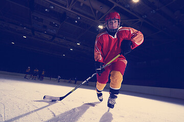 Image showing teen ice hockey player in action