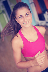 Image showing woman exercising on treadmill in gym