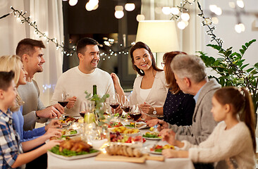 Image showing happy family having dinner party at home