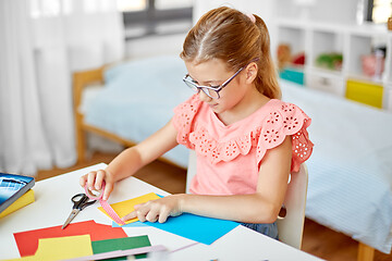 Image showing creative girl making greeting card at home