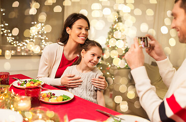 Image showing happy family taking picture at christmas dinner