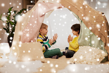 Image showing boys playing clapping game in kids tent at home