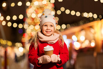 Image showing happy girl with cup of tea at christmas market