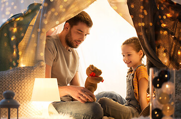 Image showing happy family playing with toy in kids tent at home