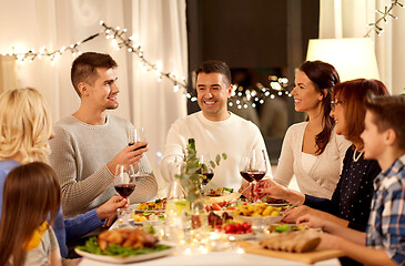 Image showing happy family having dinner party at home