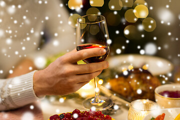 Image showing close up of man drinking red wine on christmas