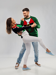 Image showing couple dancing at christmas ugly sweater party
