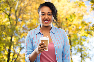 Image showing happy african american woman drinking coffee