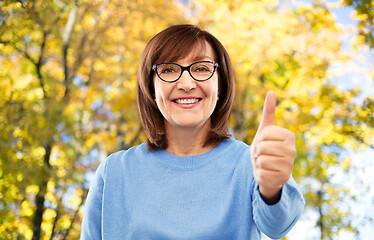 Image showing portrait of senior woman showing thumbs up