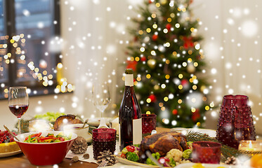 Image showing food and drinks on christmas table at home