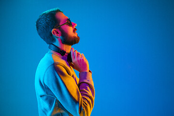 Image showing Enjoying his favorite music.